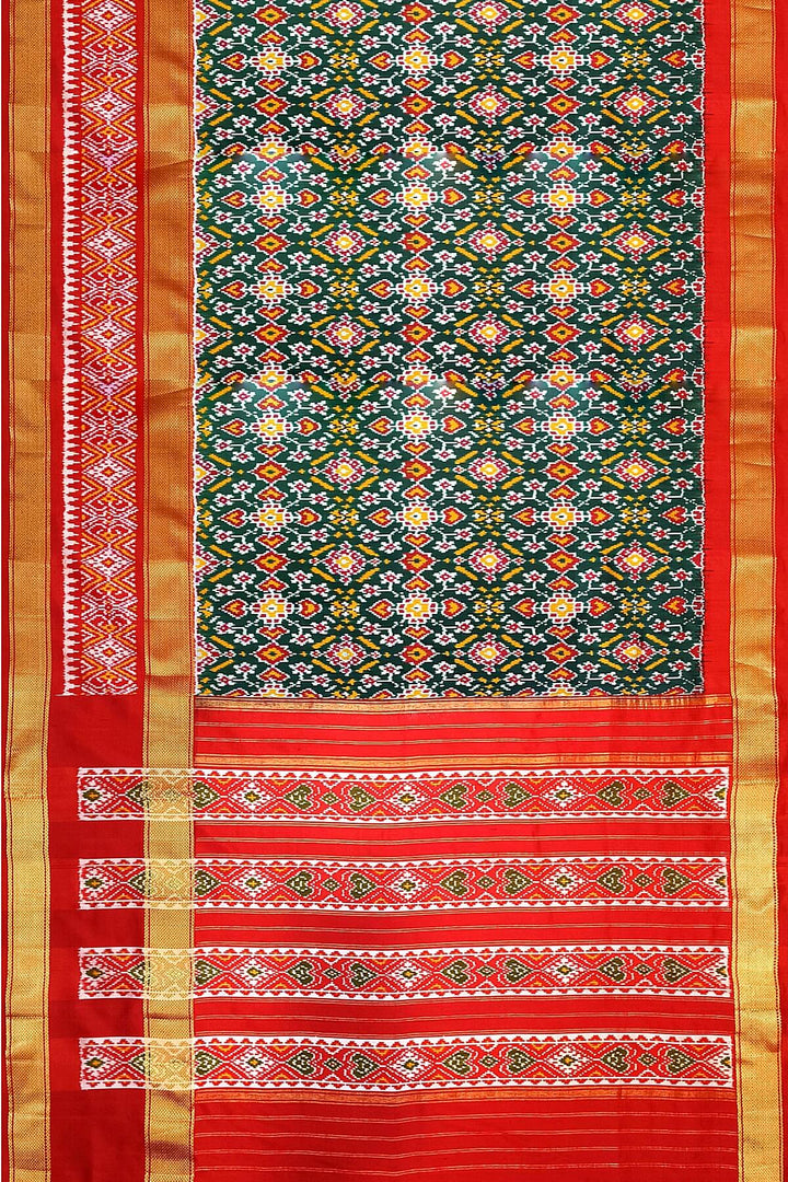 Ikkat pure silk saree in bottle green with a combo of navratan &  pan bhat pattern.