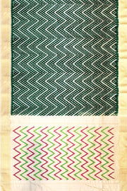Ikkat pure silk saree in bottle green in zig zag pattern.