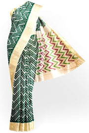 Ikkat pure silk saree in bottle green in zig zag pattern.