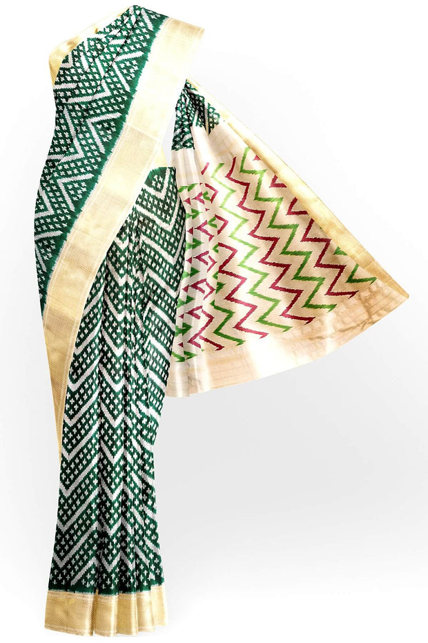 Ikkat pure silk saree in bottle green in zig zag pattern.