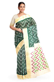 Ikkat pure silk saree in bottle green in zig zag pattern.