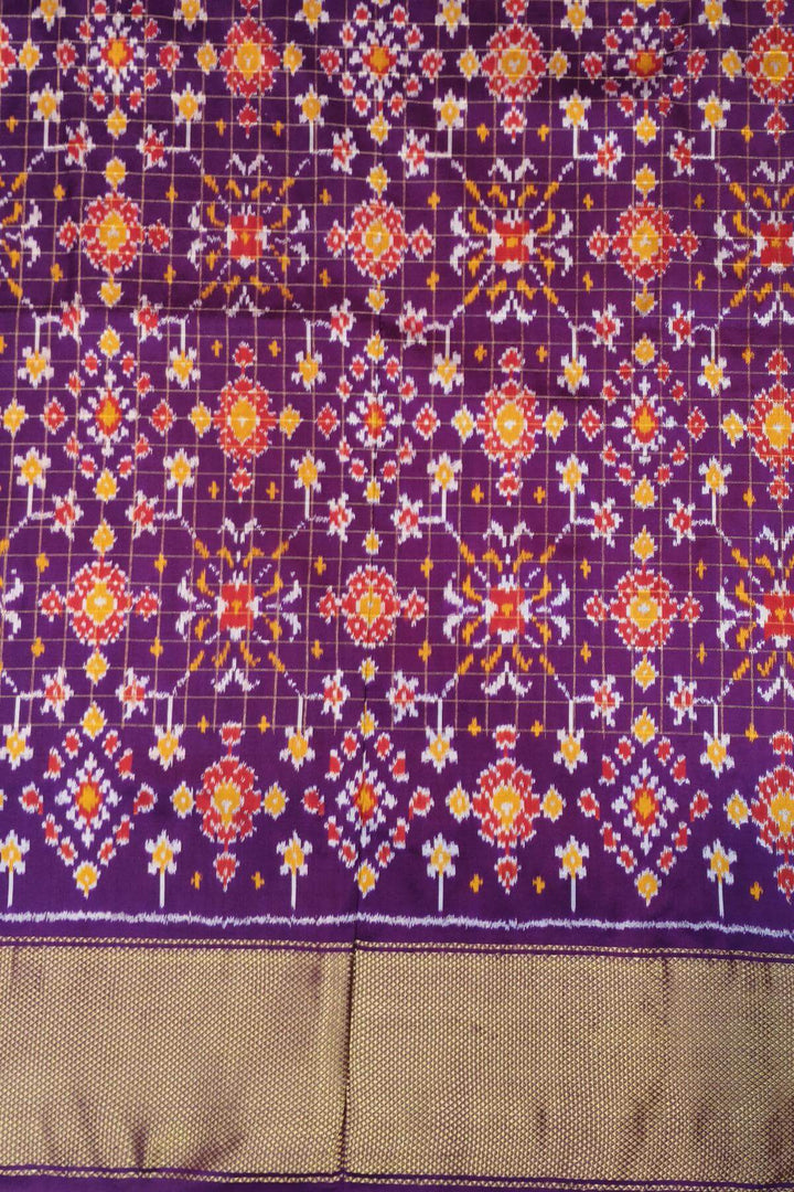 Ikat pure silk saree in orange with zari checks .