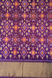 Ikat pure silk saree in orange with zari checks .