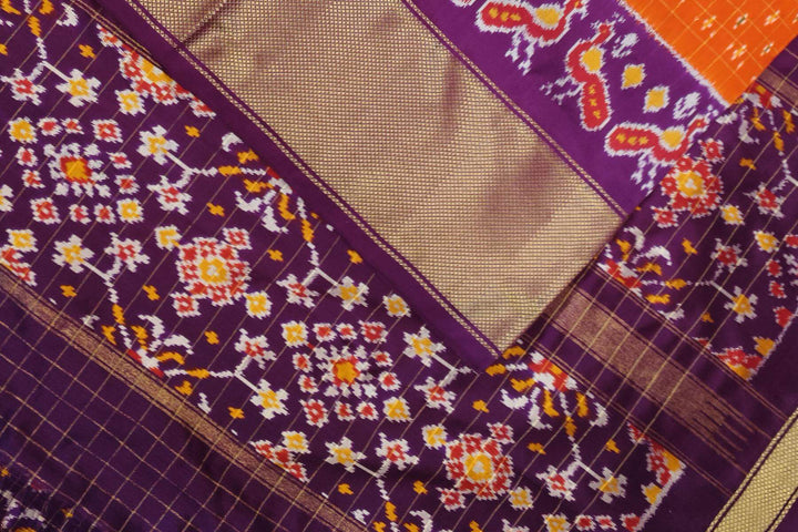 Ikat pure silk saree in orange with zari checks .