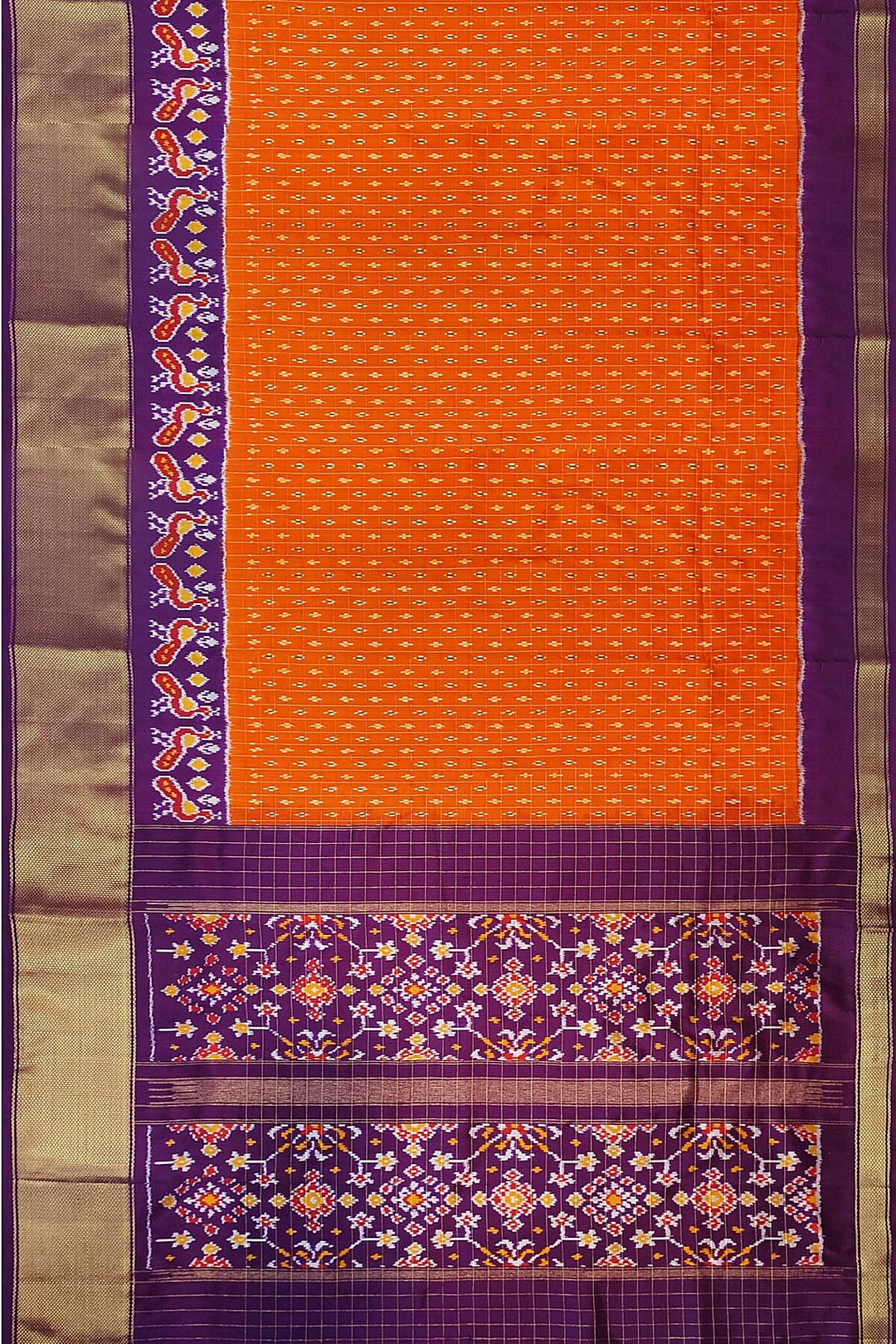 Ikat pure silk saree in orange with zari checks .