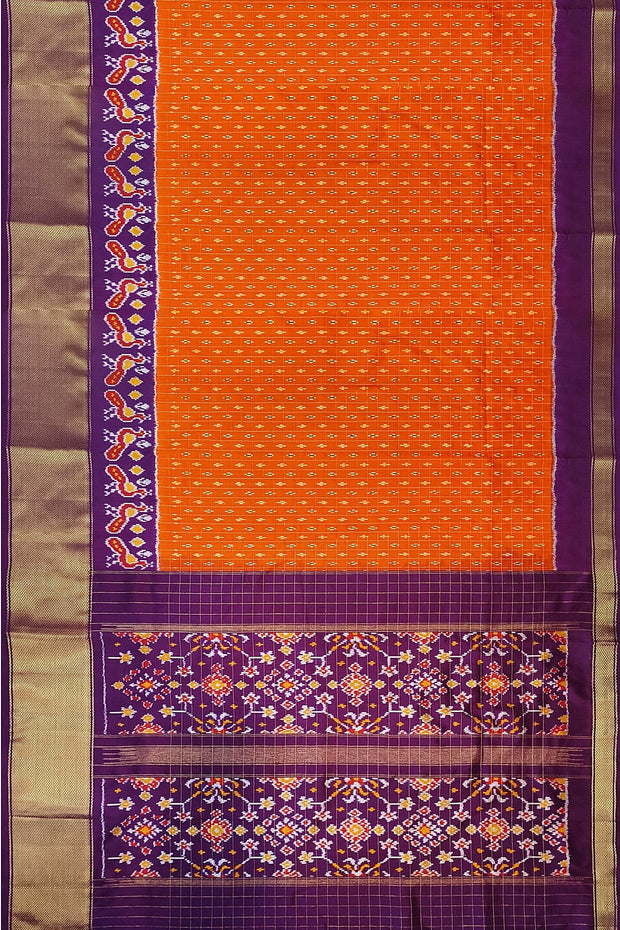Ikat pure silk saree in orange with zari checks .
