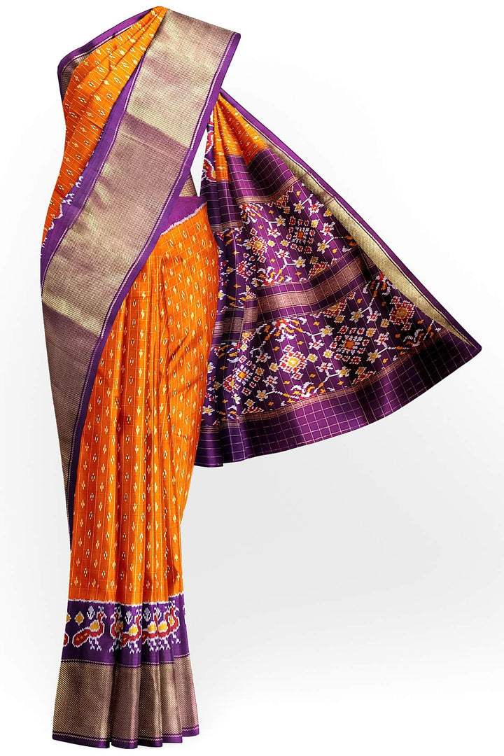 Ikat pure silk saree in orange with zari checks .