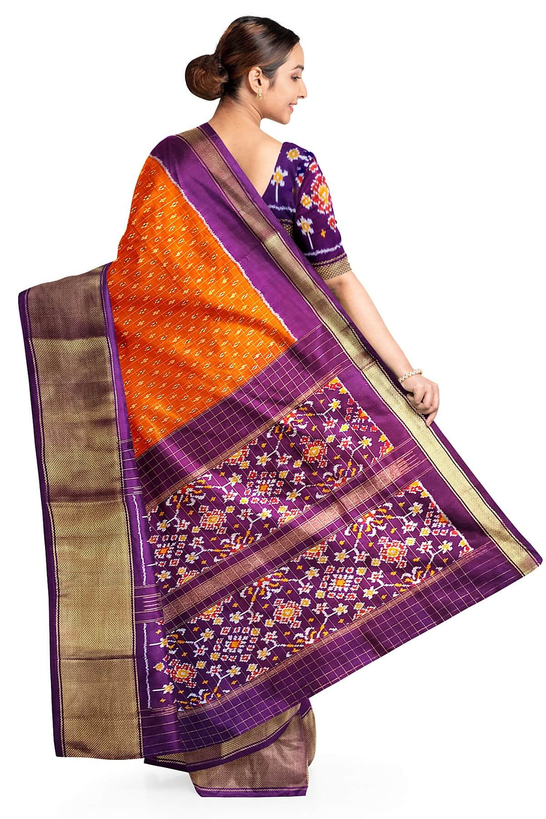 Ikat pure silk saree in orange with zari checks .