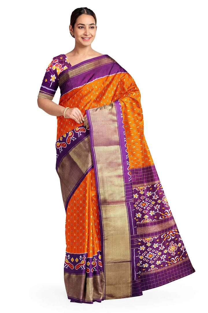 Ikat pure silk saree in orange with zari checks .