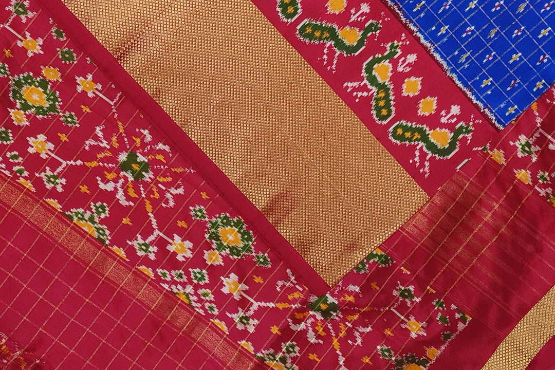 Ikat pure silk saree in blue with zari checks .