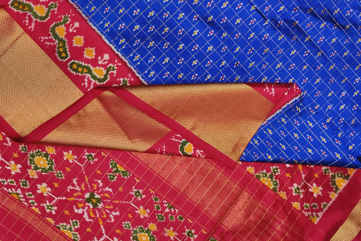 Ikat pure silk saree in blue with zari checks .