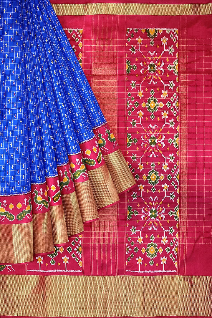 Ikat pure silk saree in blue with zari checks .