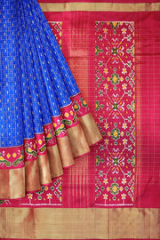Ikat pure silk saree in blue with zari checks .
