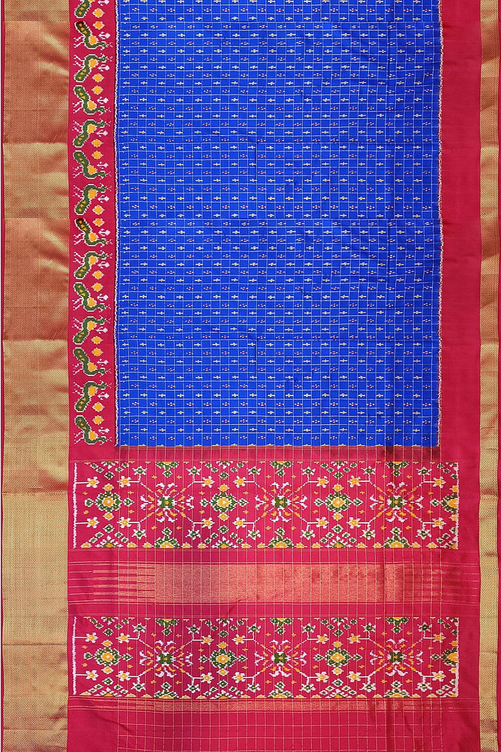 Ikat pure silk saree in blue with zari checks .
