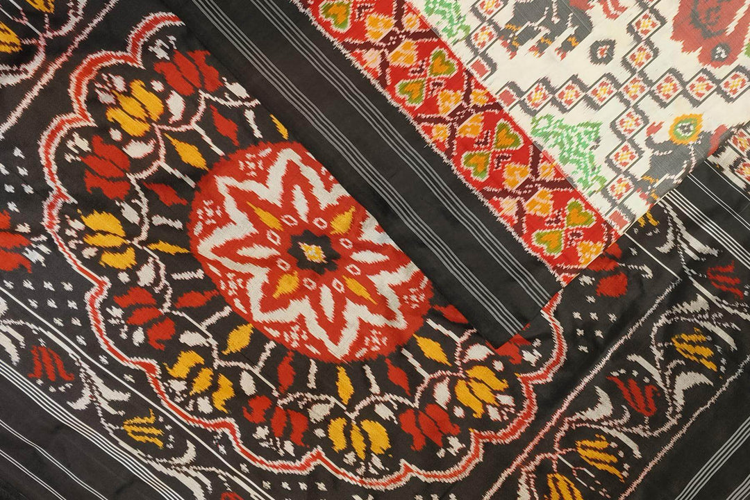 Ikkat pure silk saree in off white with birds & animal motifs.