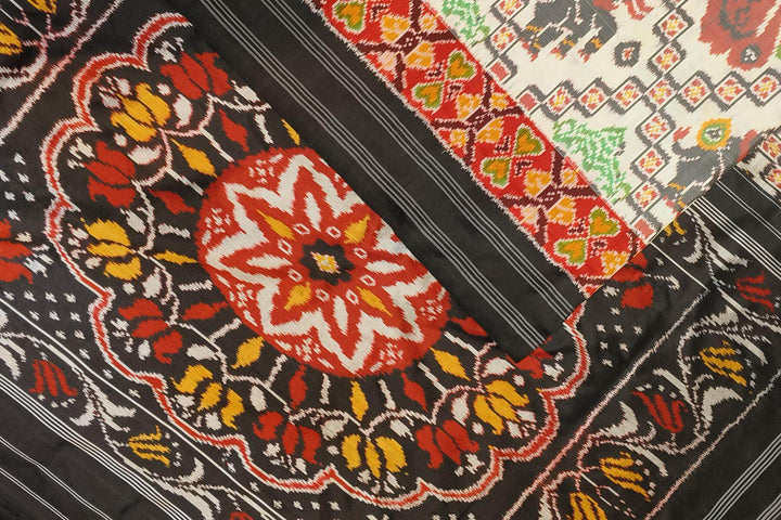 Ikkat pure silk saree in off white with birds & animal motifs.