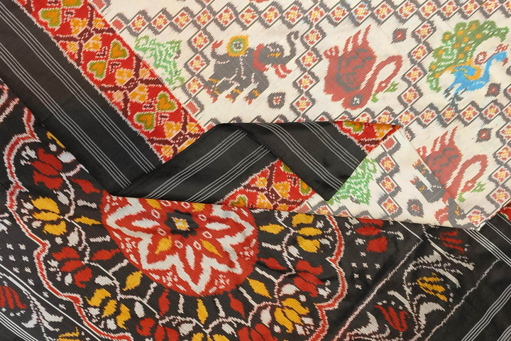 Ikkat pure silk saree in off white with birds & animal motifs.