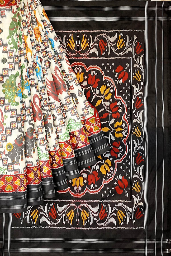 Ikkat pure silk saree in off white with birds & animal motifs.