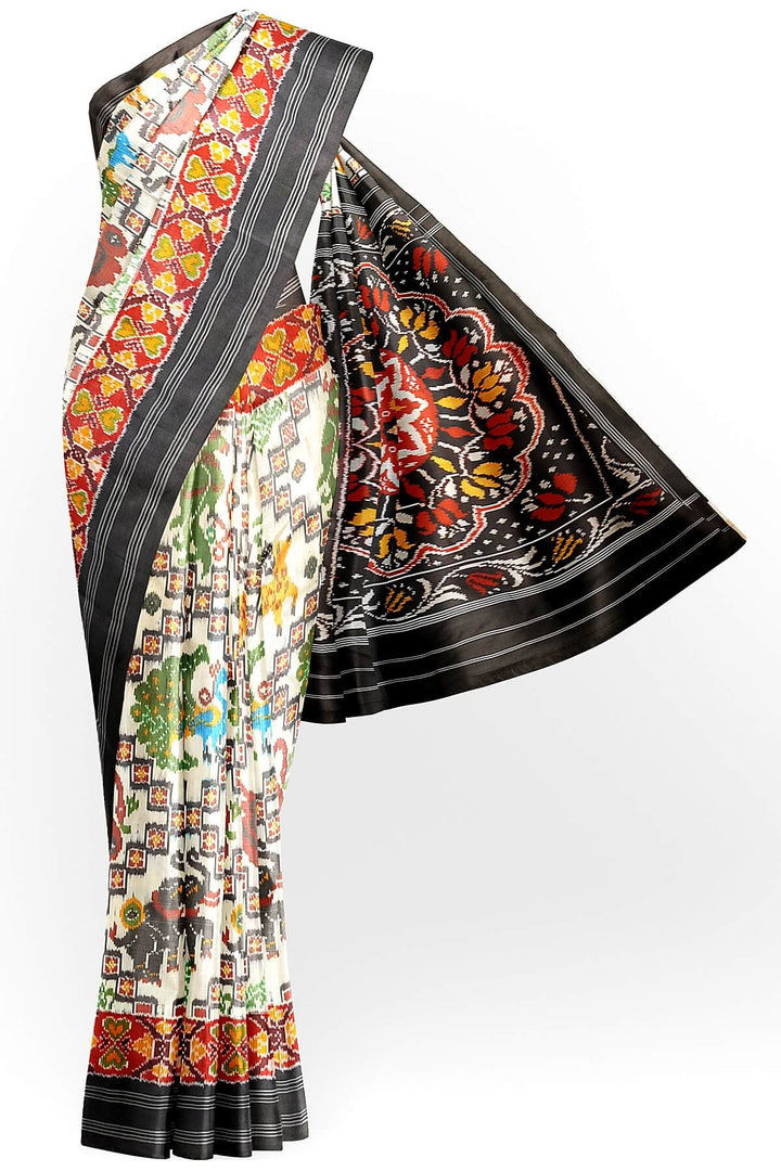 Ikkat pure silk saree in off white with birds & animal motifs.