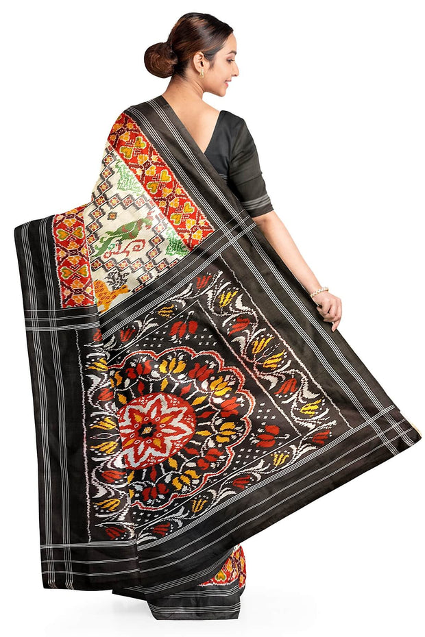 Ikkat pure silk saree in off white with birds & animal motifs.