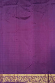 Handwoven Kanchi pure silk saree in off white and a contrast pallu in purple.