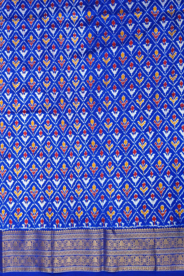 Handwoven ikat pure silk saree in rust colour with geometric pattern