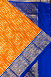 Handwoven ikat pure silk saree in rust colour with geometric pattern