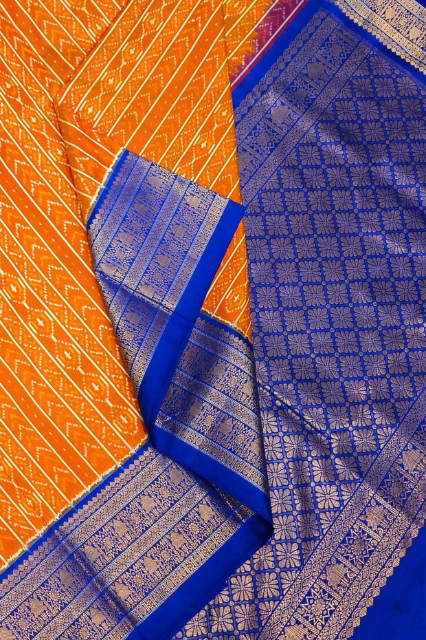 Handwoven ikat pure silk saree in rust colour with geometric pattern