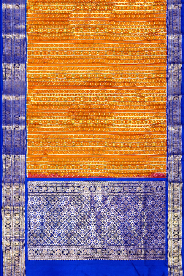 Handwoven ikat pure silk saree in rust colour with geometric pattern