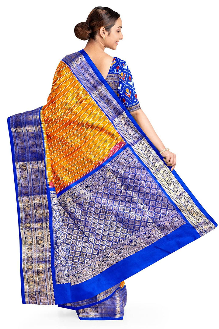 Handwoven ikat pure silk saree in rust colour with geometric pattern