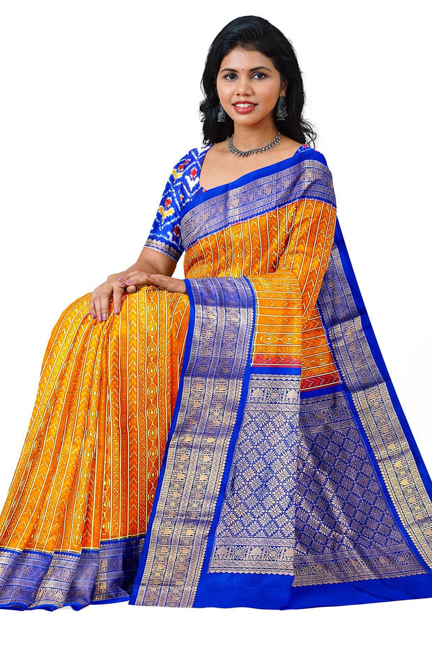 Handwoven ikat pure silk saree in rust colour with geometric pattern