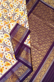 Handwoven Ikkat pure silk saree in off white with floral vines .