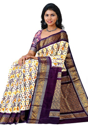Handwoven Ikkat pure silk saree in off white with floral vines .