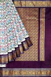 Handwoven Ikkat pure silk saree in  white with floral pattern