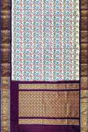 Handwoven Ikkat pure silk saree in  white with floral pattern