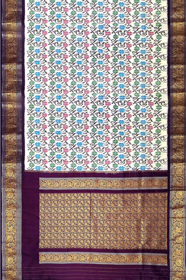 Handwoven Ikkat pure silk saree in  white with floral pattern