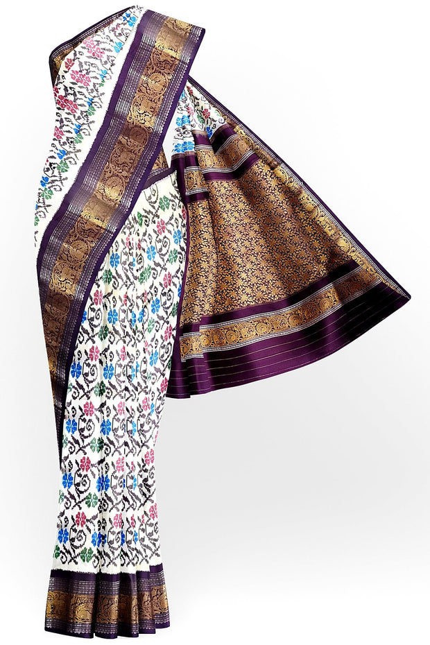 Handwoven Ikkat pure silk saree in  white with floral pattern