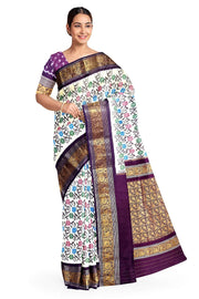Handwoven Ikkat pure silk saree in  white with floral pattern