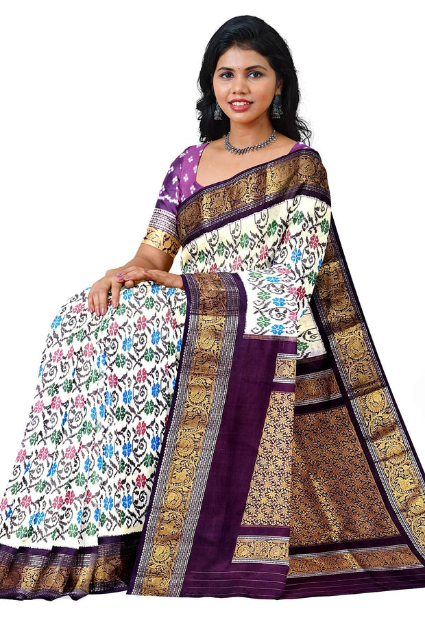 Handwoven Ikkat pure silk saree in  white with floral pattern