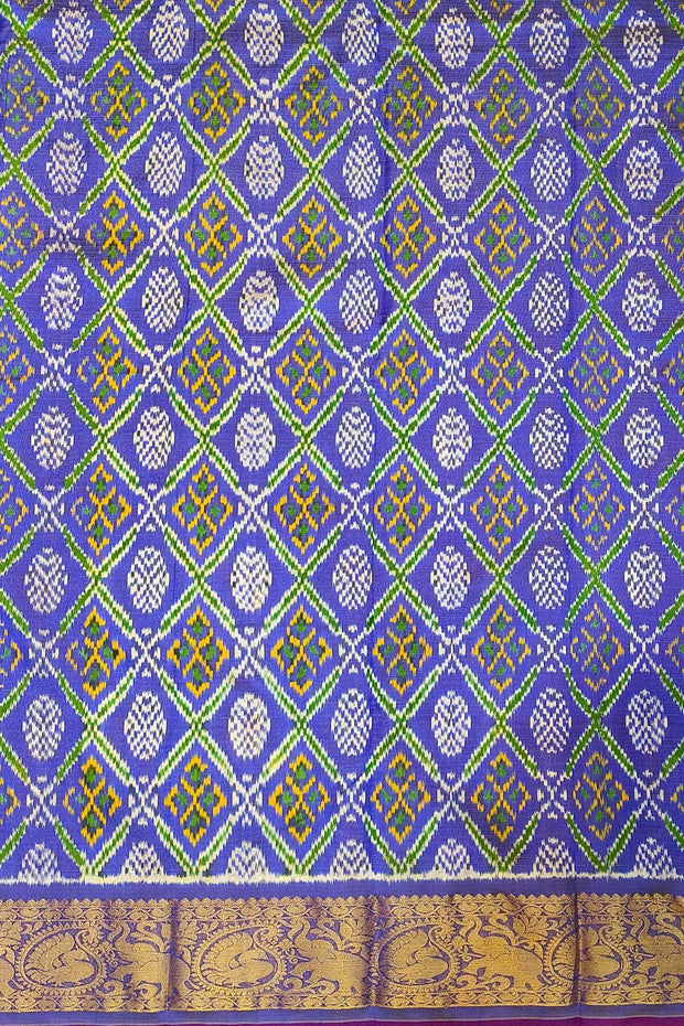 Handwoven Ikkat weave on a  fine zari striped pure silk saree in berry blue .