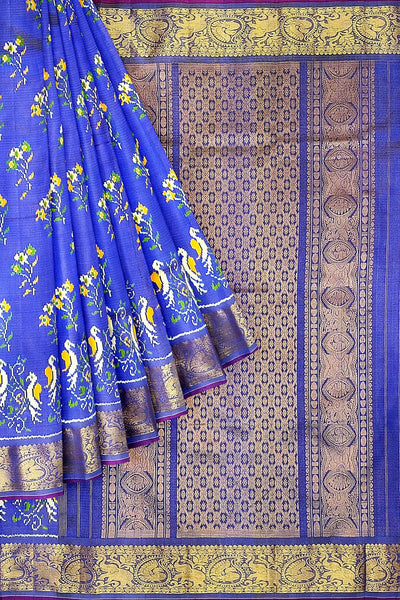 Handwoven Ikkat weave on a  fine zari striped pure silk saree in berry blue .