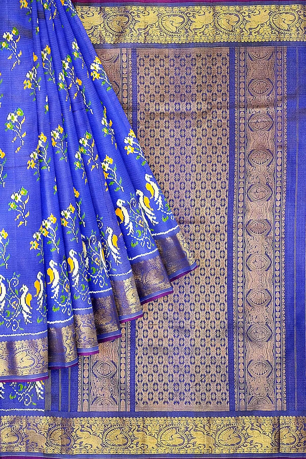 Handwoven Ikkat weave on a  fine zari striped pure silk saree in berry blue .