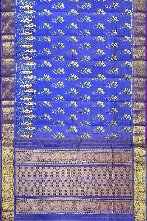 Handwoven Ikkat weave on a  fine zari striped pure silk saree in berry blue .