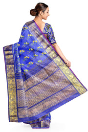Handwoven Ikkat weave on a  fine zari striped pure silk saree in berry blue .