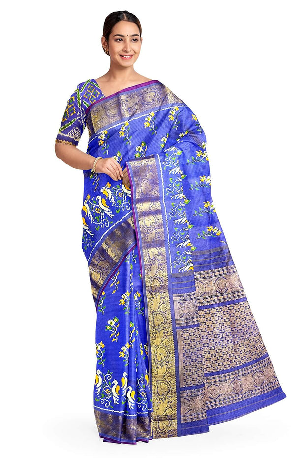 Handwoven Ikkat weave on a  fine zari striped pure silk saree in berry blue .