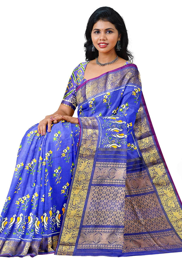 Handwoven Ikkat weave on a  fine zari striped pure silk saree in berry blue .