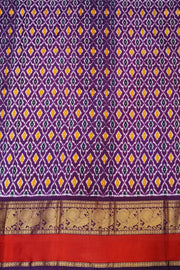 Handwoven ikat pure silk saree in multicolour with zari checks and small floral woven motifs .