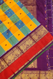 Handwoven ikat pure silk saree in multicolour with zari checks and small floral woven motifs .