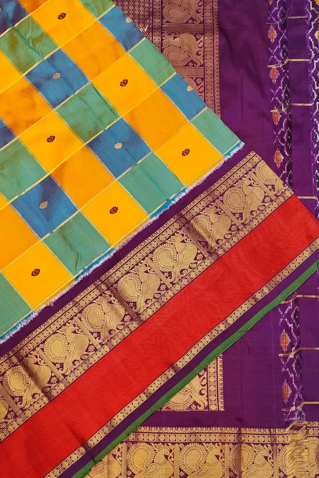 Handwoven ikat pure silk saree in multicolour with zari checks and small floral woven motifs .