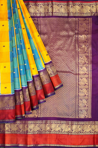 Handwoven ikat pure silk saree in multicolour with zari checks and small floral woven motifs .